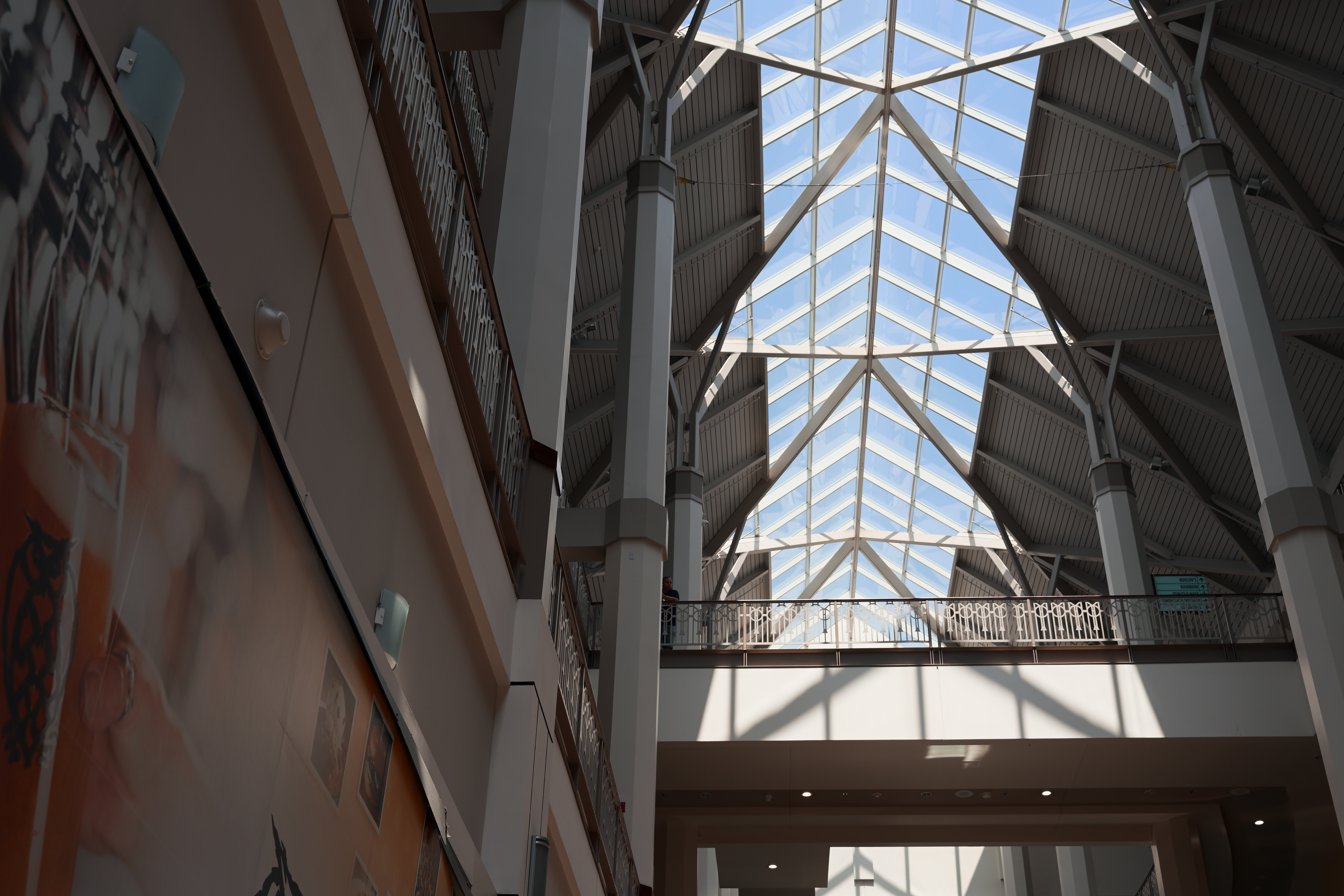 Glass atrium with skylight showing geometric angles